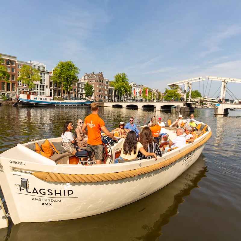 Canal experience with small boats in Amsterdam